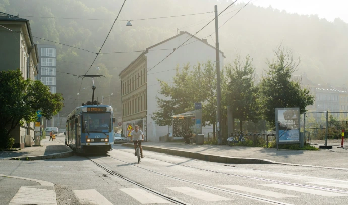 blue and white tram on road near building during daytime